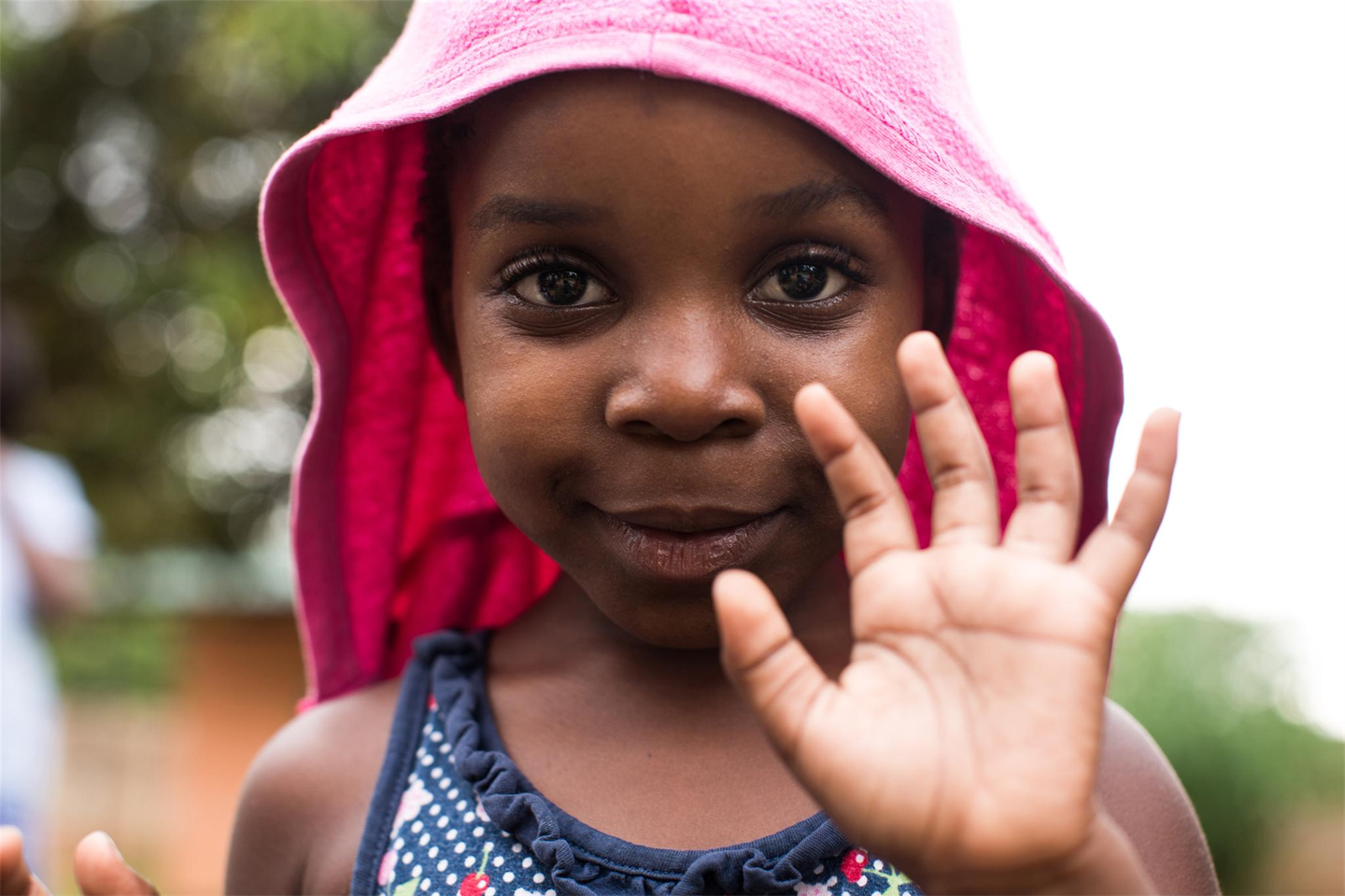 Young girl holding up her hand