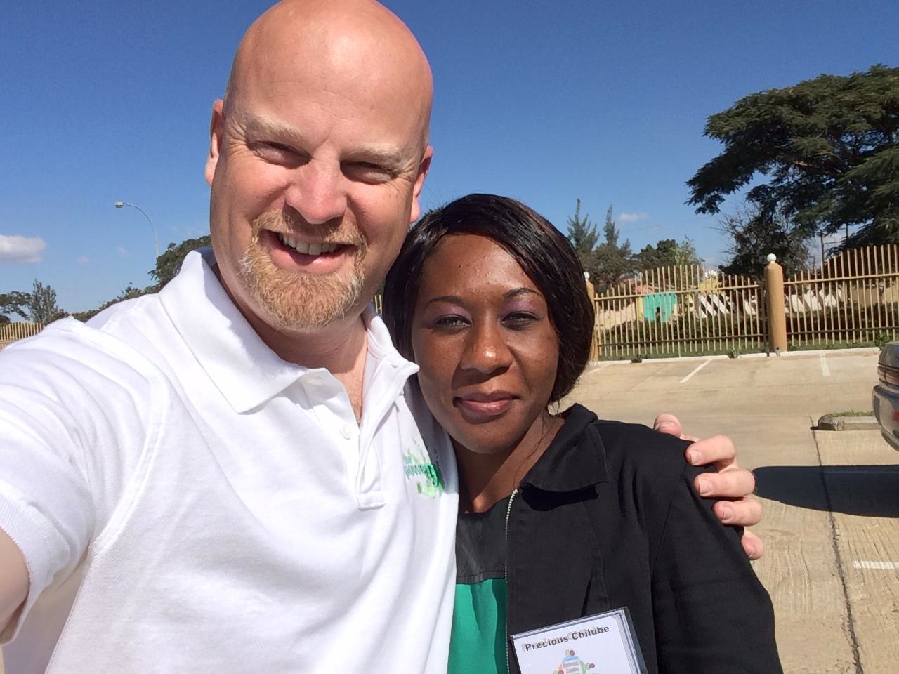 Jeff Terry with Precious Chilube at a Power of 5 event. Jeff knows that changing the lives of thousands of malnourished children is a project that must be administered carefully, and that means working through channels and committees and red tape and hurdles.
