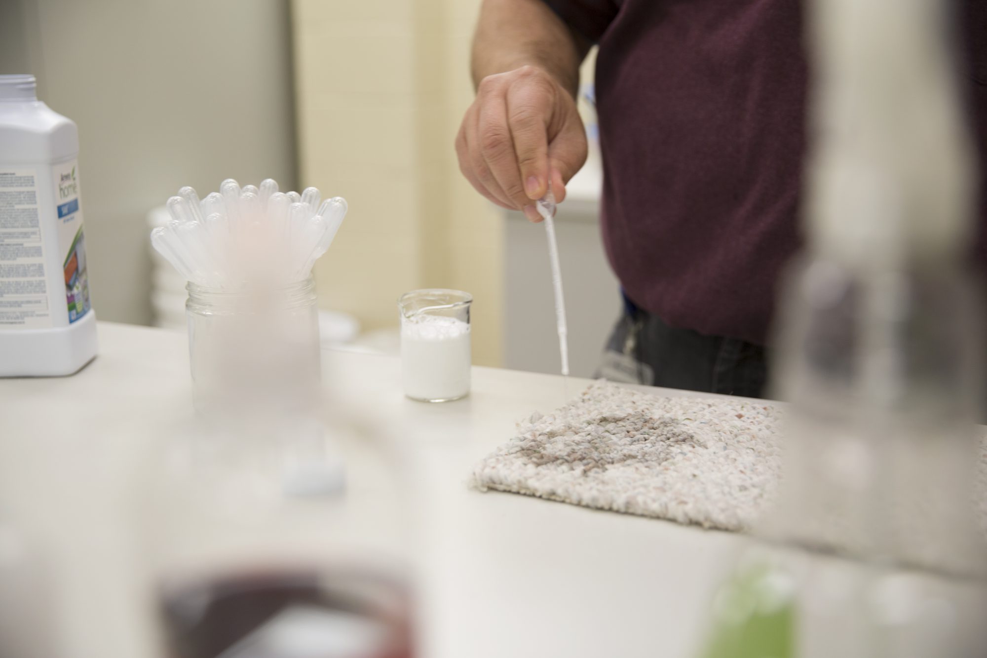 Stain expert Jim Pell tests our products on stains from around the world. Here, he's putting SA8 on a carpet stain.