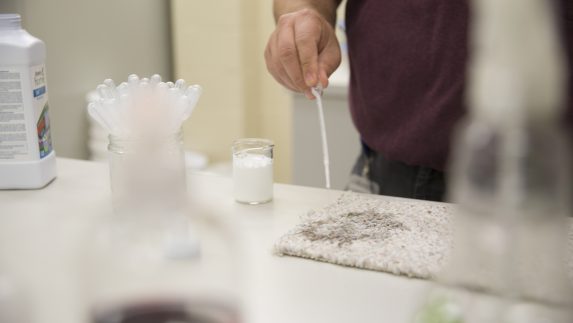 Stain expert Jim Pell tests our products on stains from around the world. Here, he's putting SA8 on a carpet stain.