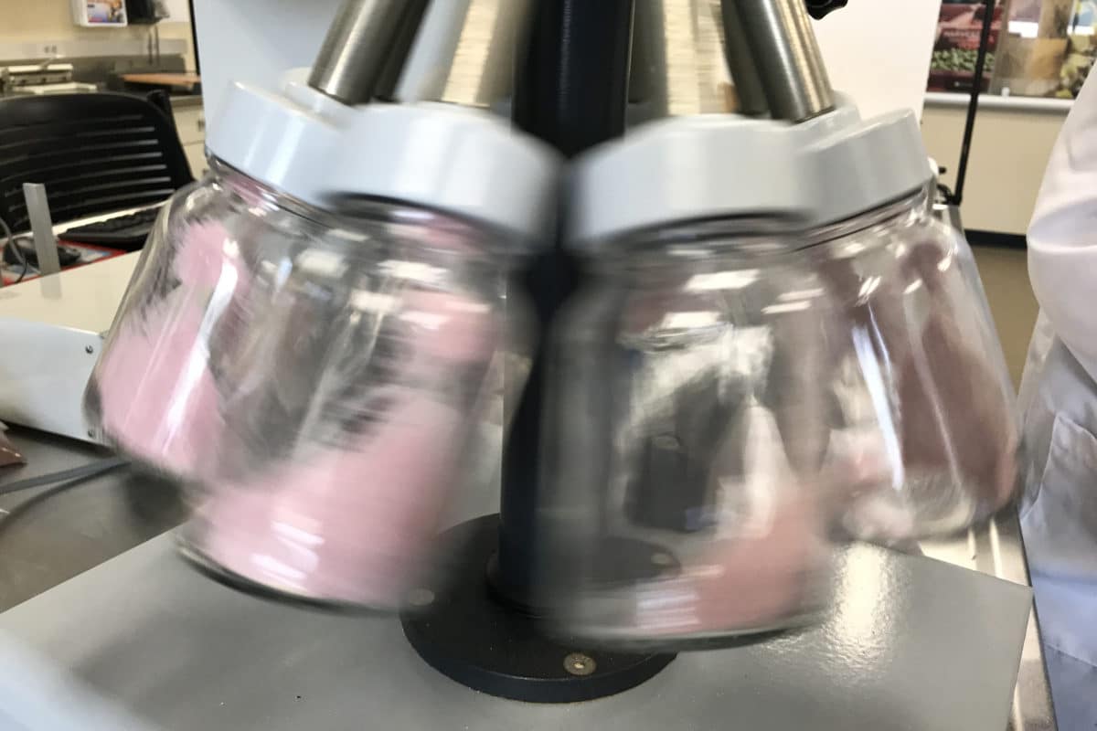 Jars being spun by a machine in a lab