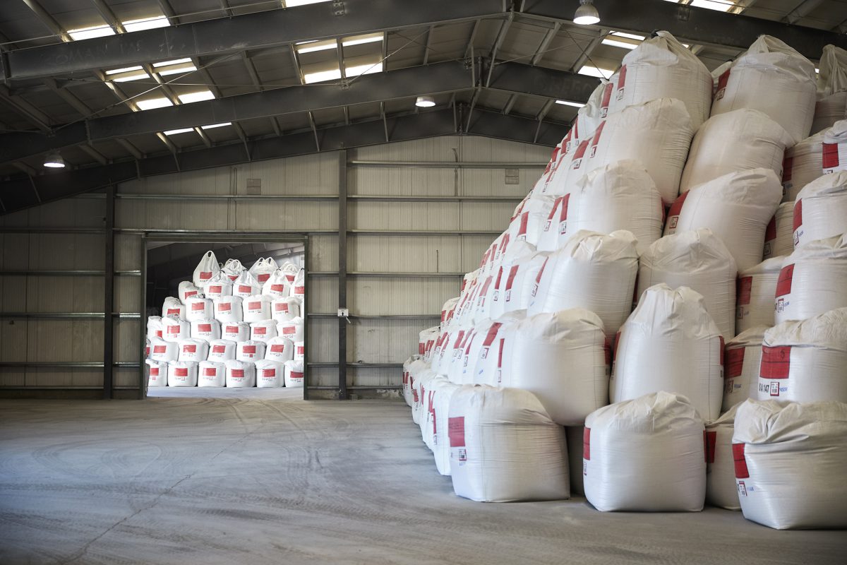 Large bags stacked on top of each other in a warehouse