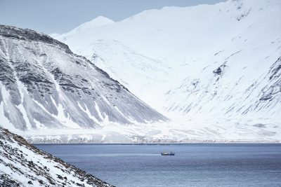 View of a harvesting boat from the mountains.