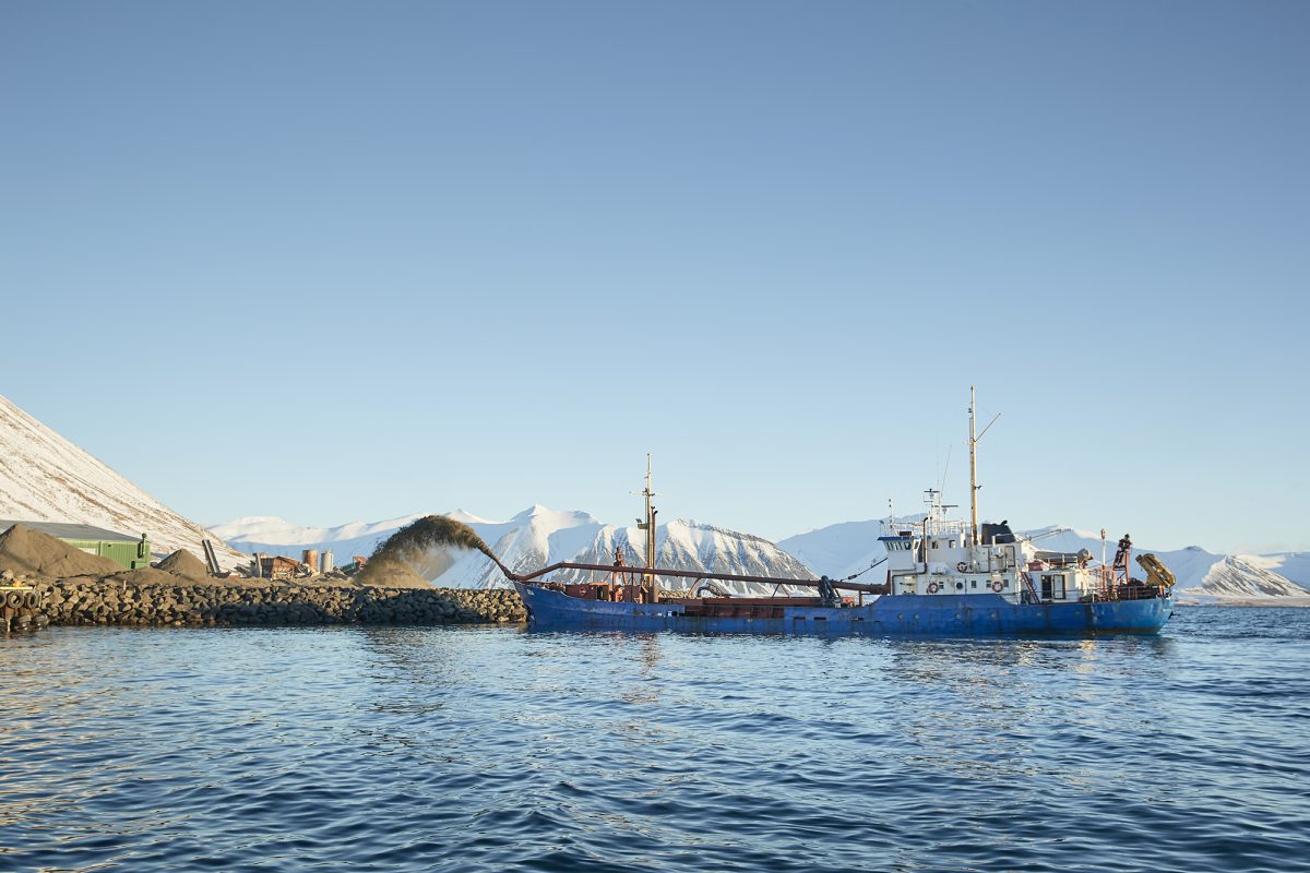 A ship harvests coralline red algae from a fjord in Iceland.