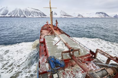 A ship harvests Calcified Seaweed from a fjord in Iceland.