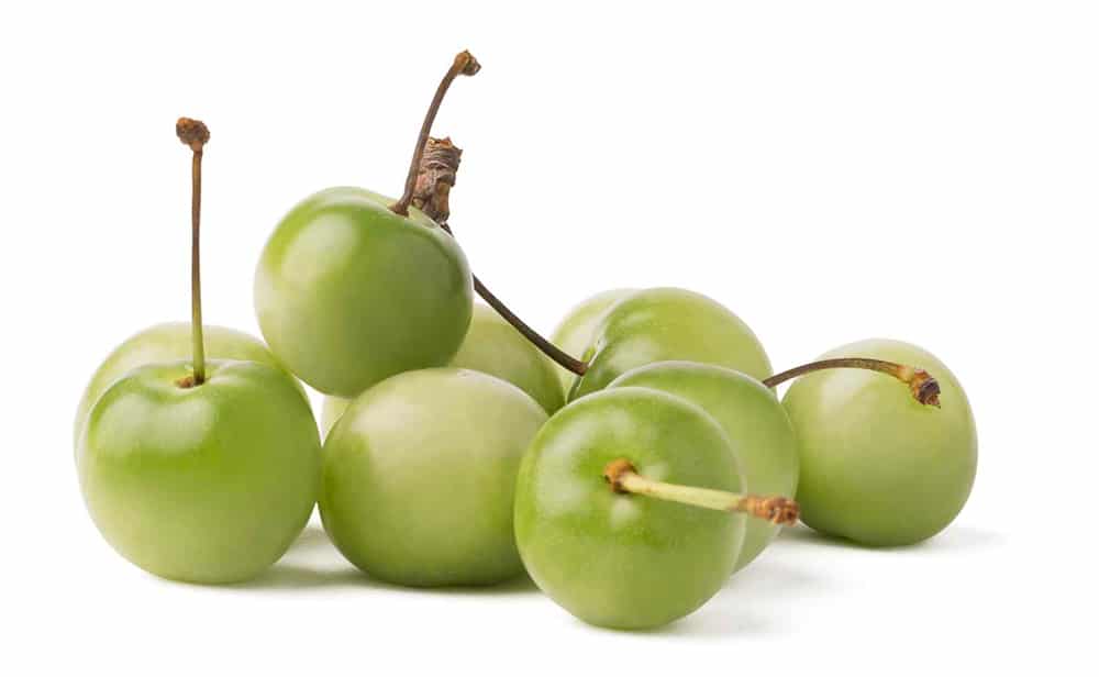 Close-up of several acerola cherries