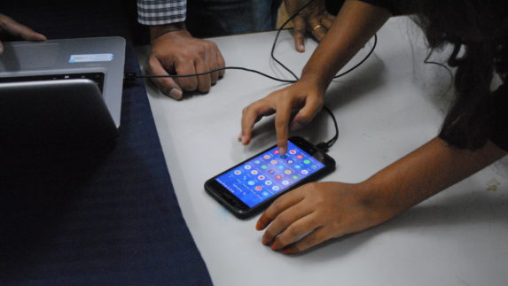 Students working with a smartphone