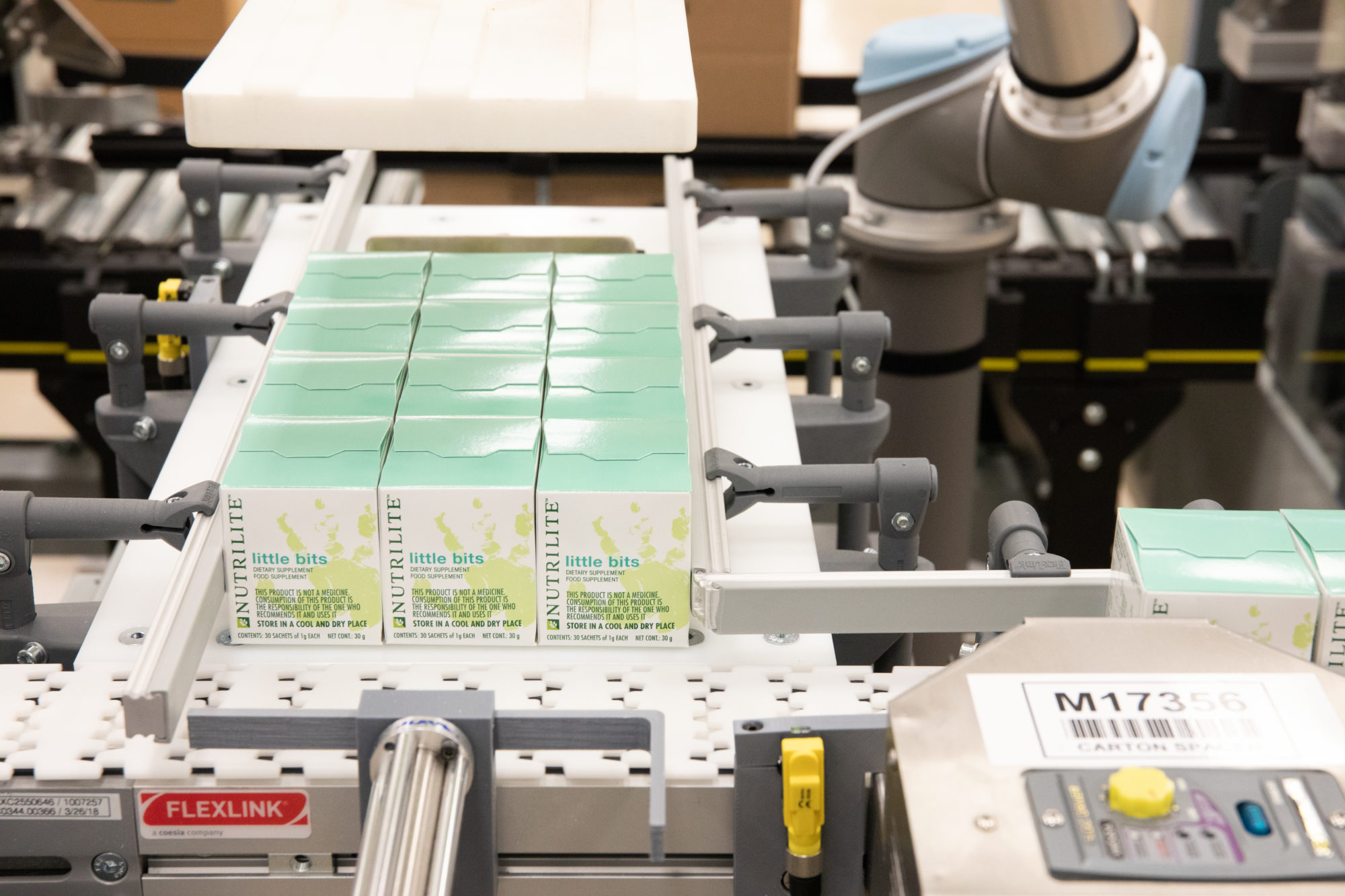 little bits packages on a conveyor belt being sorted