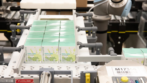 little bits packages on a conveyor belt being sorted