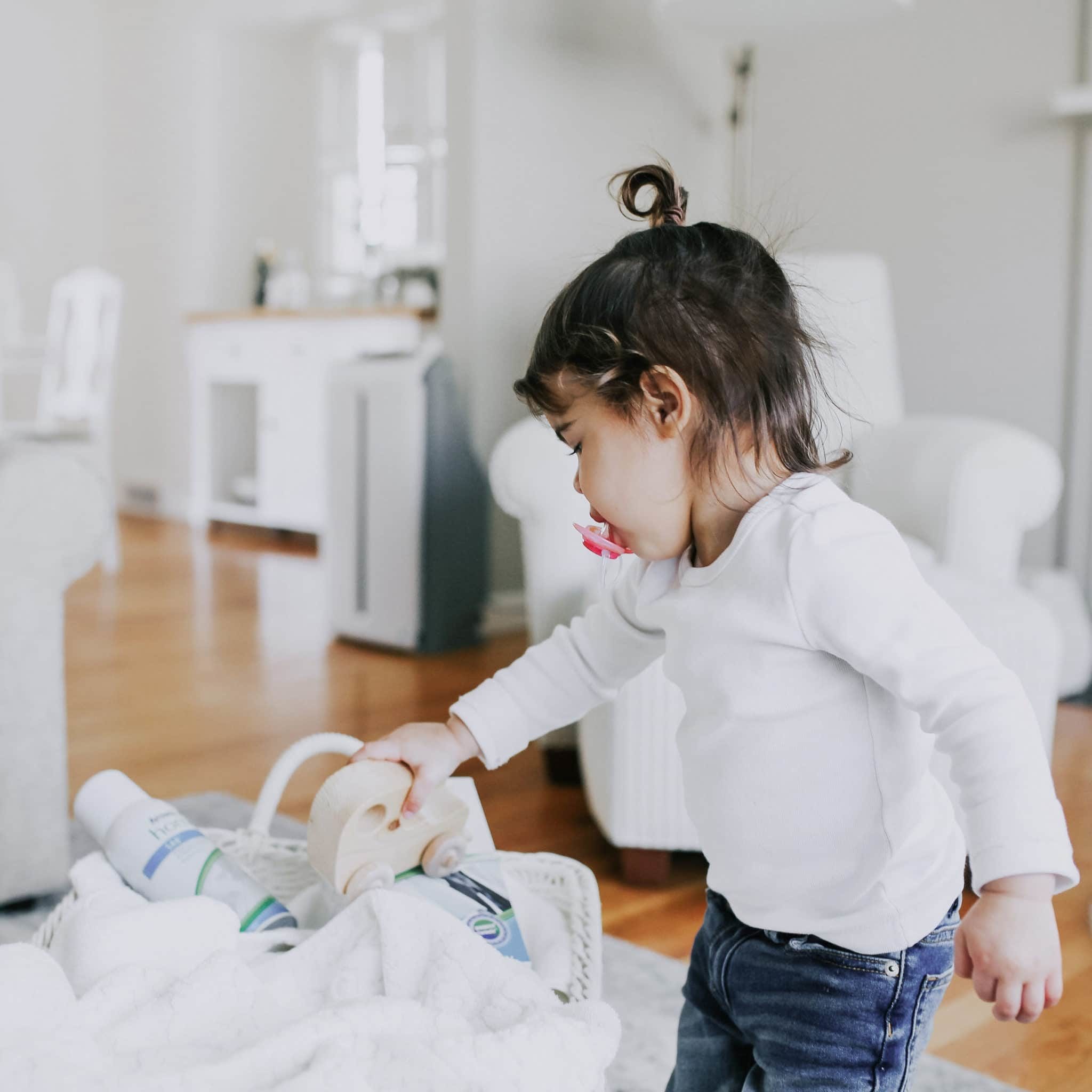 A toddler rolling a toy car over a laundry basket containing a blanket and Amway Home laundry products. Today, many Amway Home and Legacy of Clean products are recognized by the U.S. Environmental Protection Agency as part of the Safer Choice program. While not a product endorsement, the Safer Choice logo is an easy way to know you are choosing a product that is as safe as possible for people and the world around us.