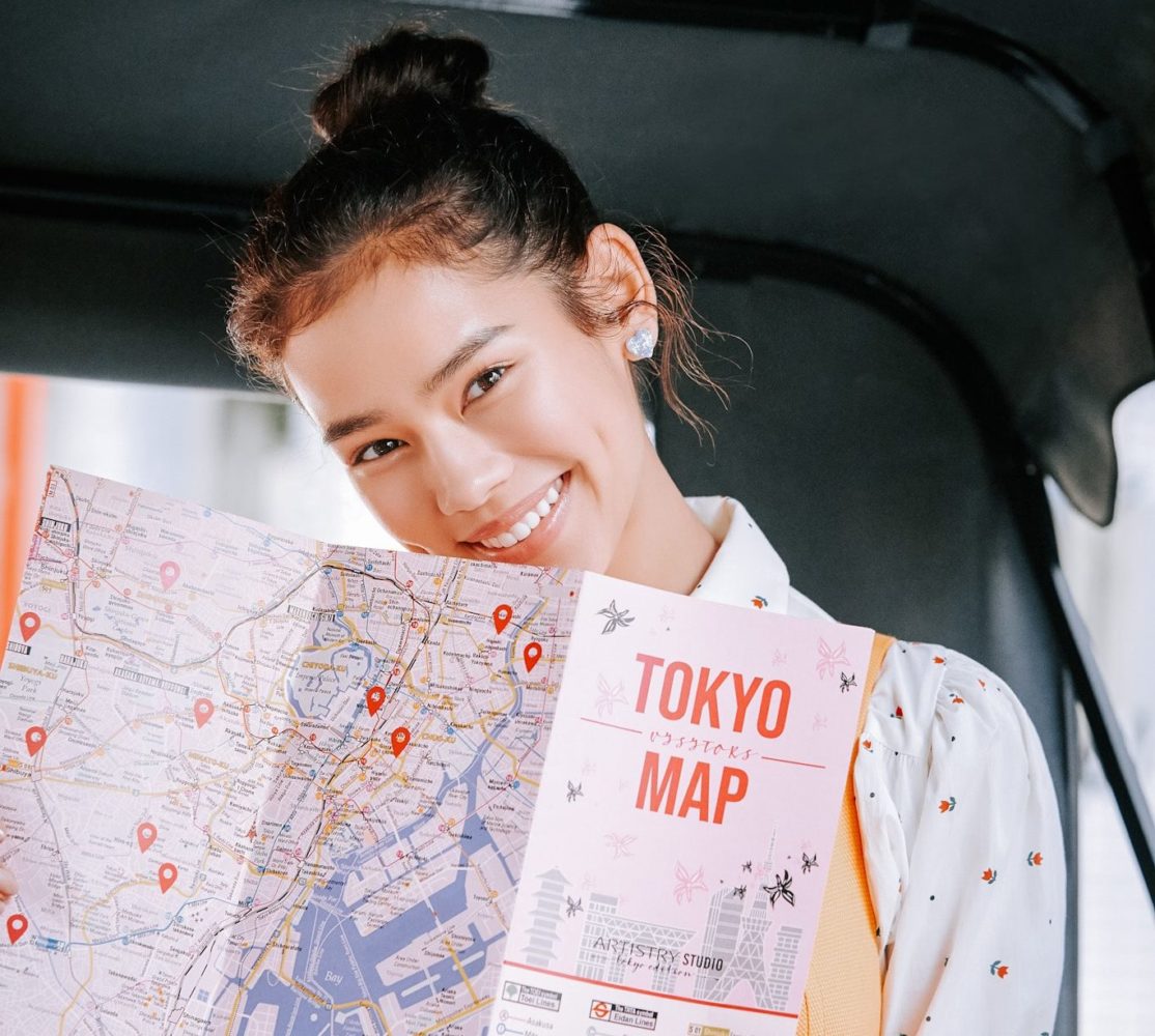 Woman holding a Tokyo map