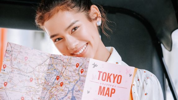 Woman holding a Tokyo map