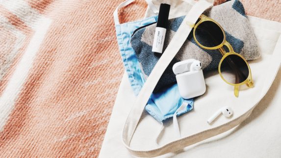 Personal belongings stacked on a bag