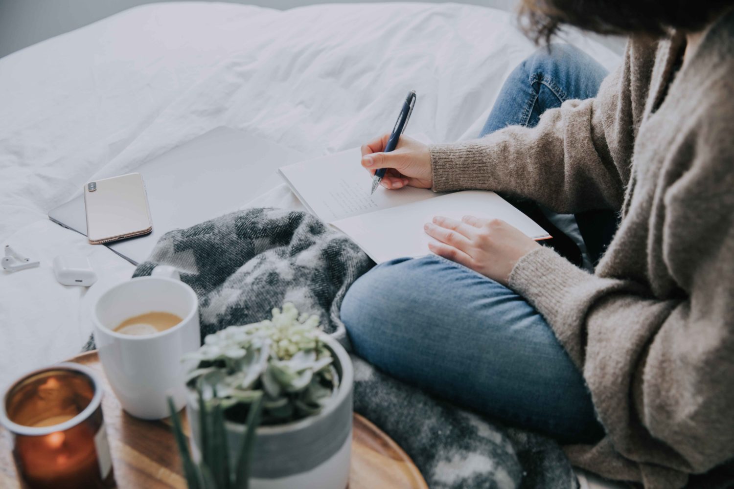 Woman writing in a journal