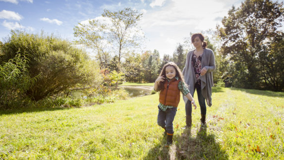 Woman and child walking outside