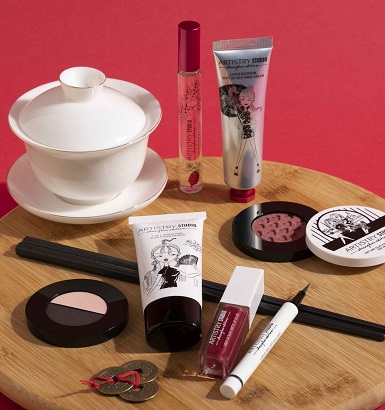 Assorted cosmetic products laid out on a table