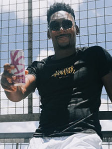 Danilo holding XS energy drink