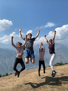 Pramilla jumping with her children