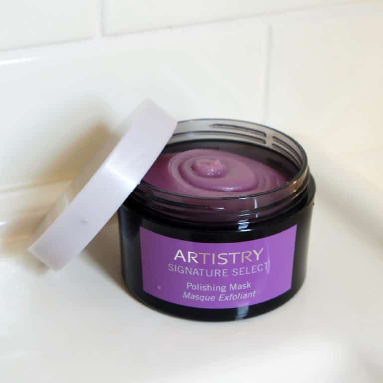 Jar of Artistry signature select polishing mask open on a shower ledge