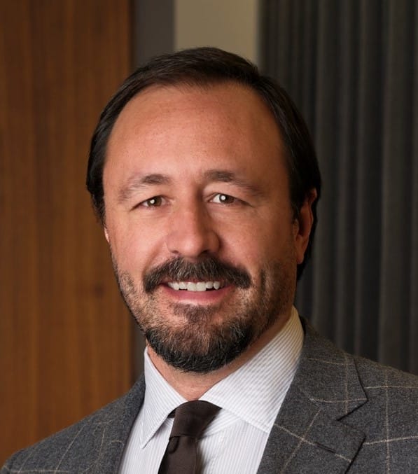 Rick DeVos, an Amway founding family member, appears in this profile image.