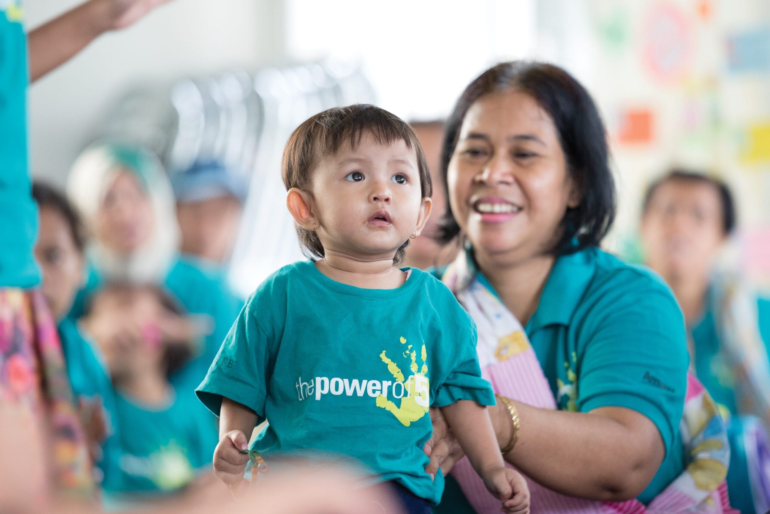 Mother and child wearing Power of Five shirts