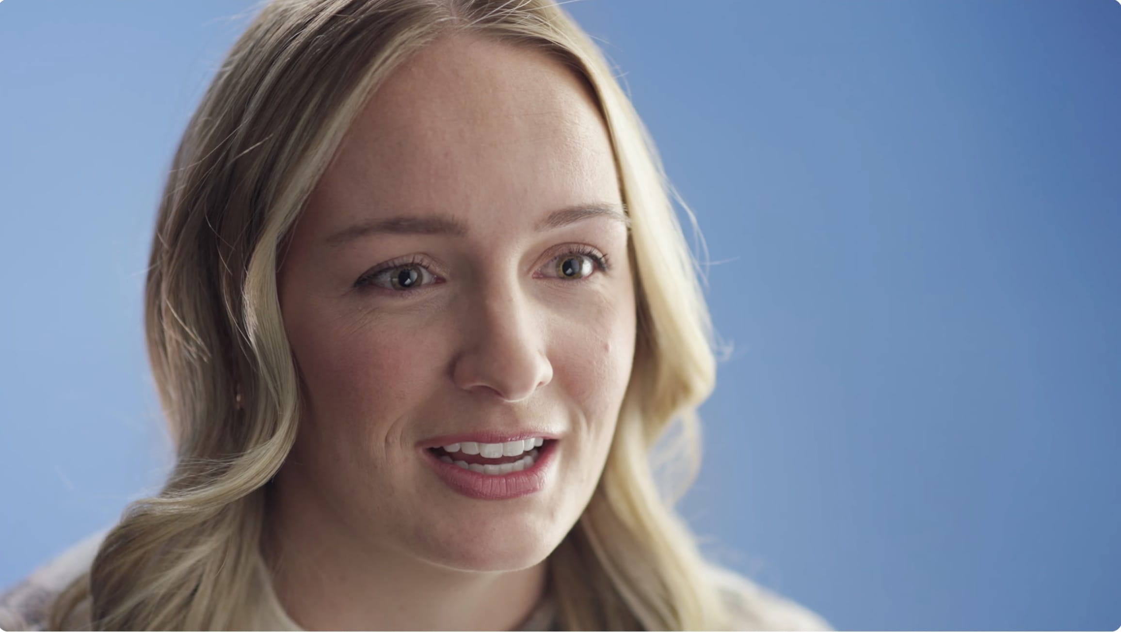 Video thumbnail of Monreau DeVos Stewart wearing a cream sweather with a darker floral pattern. She is sitting in front of a blue background and discussing the value of personal worth.